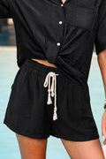 Schwarze Shorts mit elastischem Bund und weitem Bein