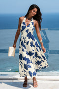 Blau geblümtes elegantes Neckholder-Maxikleid